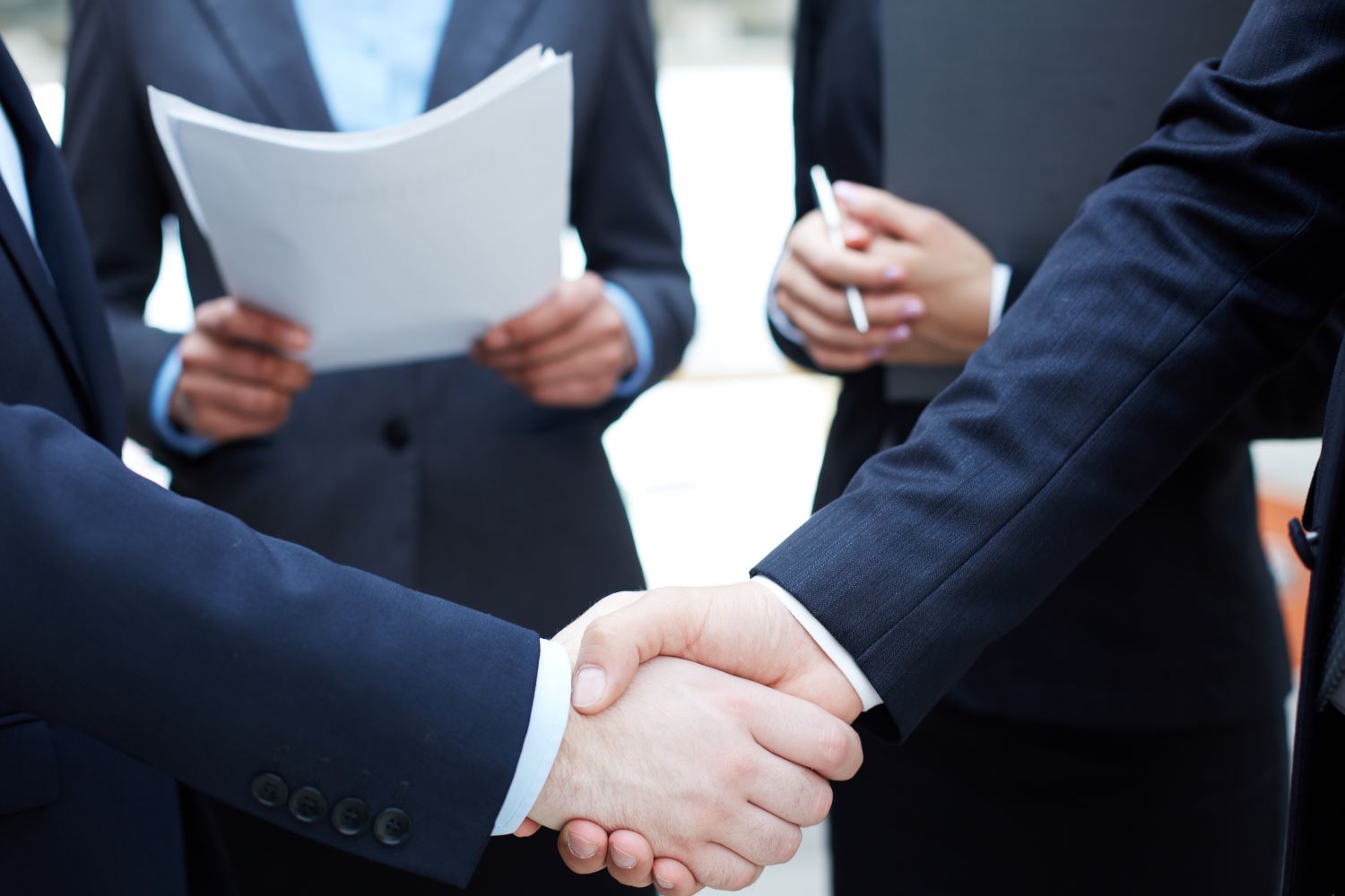 https://www.newcablojistik.com/wp-content/uploads/2023/07/handshake-executives-greeting-each-other1.jpg