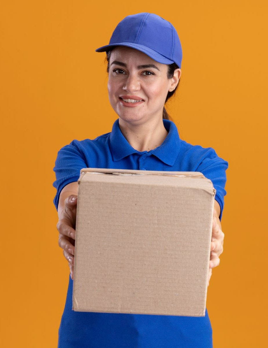 https://www.newcablojistik.com/wp-content/uploads/2023/07/smiling-young-delivery-woman-uniform-cap-with-cardboard-box-1.jpg